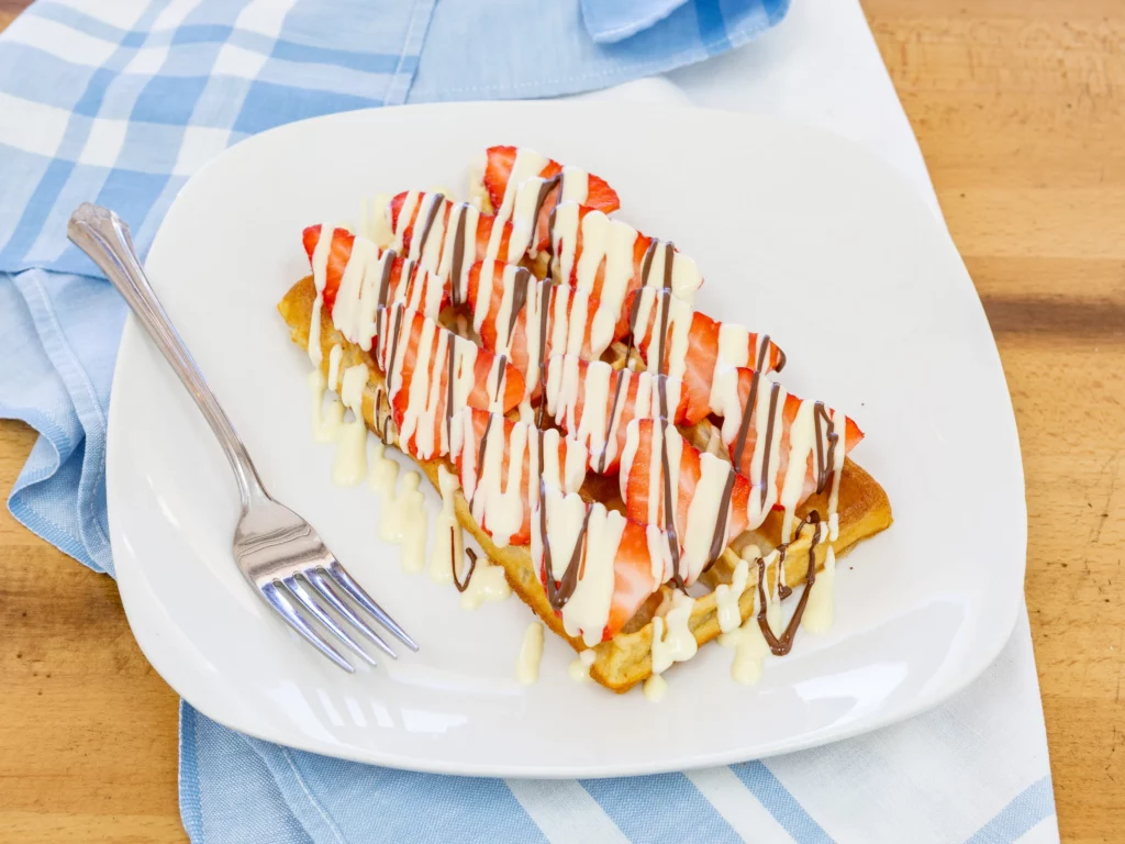 Waffle with strawberries on a plate