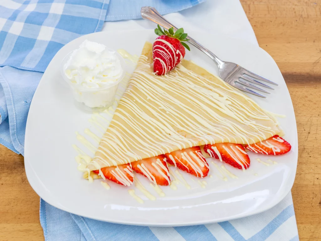 Crepe with strawberries on a plate