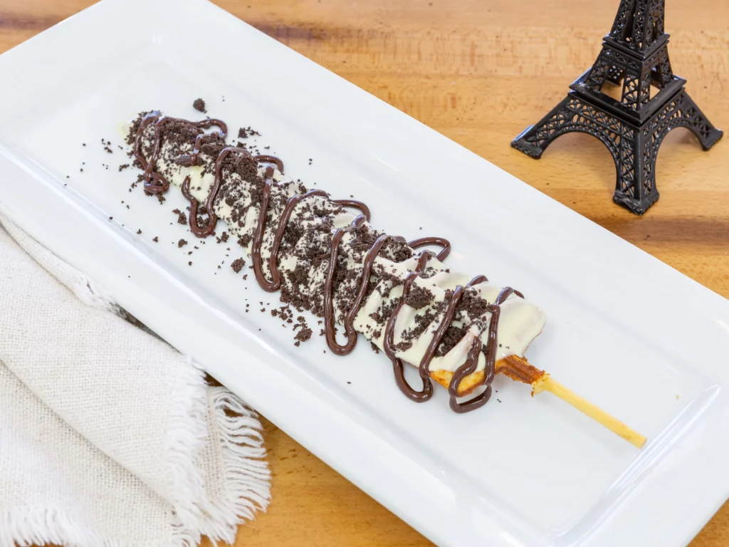 Waffle stick with chocolate on a plate